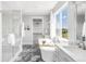 Large bathroom with soaking tub, walk in shower, double vanity, and large window at 19887 Kershaw Ct, Monument, CO 80132
