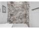Stylish bathroom with a tiled shower, a built-in shelf, and modern fixtures at 19887 Kershaw Ct, Monument, CO 80132
