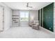 Bedroom with carpet, large window, shelving and uniquely designed wall with a chair at 19887 Kershaw Ct, Monument, CO 80132