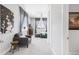 Comfortable bedroom featuring scenic views, a seating area, and neutral decor at 19887 Kershaw Ct, Monument, CO 80132