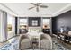 Comfortable main bedroom with two windows, ceiling fan and stylish furnishings at 19887 Kershaw Ct, Monument, CO 80132