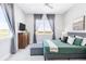 Bright bedroom with a view, ceiling fan, and classic decor at 19887 Kershaw Ct, Monument, CO 80132
