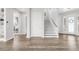 Open entryway with hardwood floors, white walls, stairs, and lots of natural light at 19887 Kershaw Ct, Monument, CO 80132