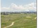 Enjoy this beautiful golf course view with mountain backdrops and big fluffy clouds at 19887 Kershaw Ct, Monument, CO 80132