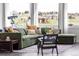 Cozy living room featuring a comfortable olive-green sofa, accent pillows, and beautiful views at 19887 Kershaw Ct, Monument, CO 80132