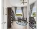 Bright office space with views of the golf course, stylish decor, and a ceiling fan at 19887 Kershaw Ct, Monument, CO 80132