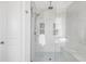 Bright shower with white subway tile, mosaic tile accent, rainfall shower head and built-in bench at 19887 Kershaw Ct, Monument, CO 80132