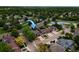 An aerial shot showcasing the property's location in a neighborhood with mature trees and close to a green space at 3142 Captains Ln, Longmont, CO 80503