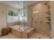 Bathroom featuring a separate shower and soaking tub, and multiple windows that provide natural light at 3142 Captains Ln, Longmont, CO 80503