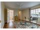 Spacious bedroom featuring hardwood floors, neutral walls, a ceiling fan and views of the outdoor landscape at 3142 Captains Ln, Longmont, CO 80503
