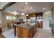 Bright kitchen featuring a center island with granite countertop and custom wood cabinetry with stainless steel appliances at 3142 Captains Ln, Longmont, CO 80503