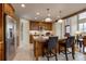 Gourmet kitchen with stainless steel appliances, granite countertops, subway tile backsplash, and bar seating at 3142 Captains Ln, Longmont, CO 80503