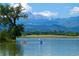 Kayaks on a lake with mountain views at 3142 Captains Ln, Longmont, CO 80503