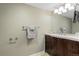 Basement bathroom with vanity and mirror at 2602 S Lafayette St, Denver, CO 80210