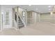 Finished basement with neutral carpeting, stairs, and plenty of storage at 2602 S Lafayette St, Denver, CO 80210