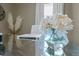 Modern glass desk with flowers in a vase at 2602 S Lafayette St, Denver, CO 80210