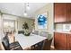 Dining area with modern light fixture and built-in cabinetry at 2602 S Lafayette St, Denver, CO 80210