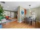 Open dining area with hardwood floors and view of living room at 2602 S Lafayette St, Denver, CO 80210