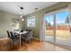 Bright dining room features a table with six chairs and access to backyard at 2602 S Lafayette St, Denver, CO 80210