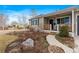 Landscaped front yard with walkway leading to porch at 2602 S Lafayette St, Denver, CO 80210