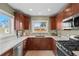 Modern kitchen with stainless steel appliances and quartz countertops at 2602 S Lafayette St, Denver, CO 80210