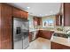 Modern kitchen with stainless steel appliances and L-shaped counter at 2602 S Lafayette St, Denver, CO 80210