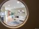 View of living room through circular opening at 2602 S Lafayette St, Denver, CO 80210