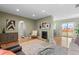 Open concept living room with dining area and fireplace at 2602 S Lafayette St, Denver, CO 80210