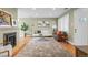 Living room with fireplace, large windows, and comfy seating at 2602 S Lafayette St, Denver, CO 80210