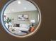 View of living room through circular opening at 2602 S Lafayette St, Denver, CO 80210