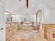 Spacious bathroom with dual vanities, tiled flooring, a soaking tub, and glass shower at 1075 E Oxford Ln, Cherry Hills Village, CO 80113