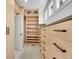 Walk-in closet with custom shelving, ample storage, and natural light at 1075 E Oxford Ln, Cherry Hills Village, CO 80113