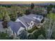 A captivating aerial view of a luxurious, bright home with manicured landscaping and a metal roof at 1075 E Oxford Ln, Cherry Hills Village, CO 80113