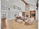 Open-concept living room showcasing a stone fireplace and ample natural light at 1075 E Oxford Ln, Cherry Hills Village, CO 80113