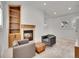 Open living room with built-in shelving, a fireplace, and comfortable seating at 1075 E Oxford Ln, Cherry Hills Village, CO 80113