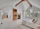 Main bedroom featuring a fireplace, vaulted ceiling, decorative beam, and bright windows at 1075 E Oxford Ln, Cherry Hills Village, CO 80113