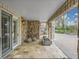 Covered stone porch with plenty of space for relaxing includes modern stone pavers and a stone seating area with a gas fire pit at 1075 E Oxford Ln, Cherry Hills Village, CO 80113