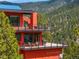 Modern red house with multiple balconies and mountain views at 5896 Peregrine Trl, Golden, CO 80403
