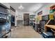 Well-organized garage space featuring ample storage solutions, a functional workbench, and a convenient shower area at 5896 Peregrine Trl, Golden, CO 80403