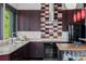 Well-equipped kitchen features a modern backsplash, updated appliances, generous counter space, and scenic views at 5896 Peregrine Trl, Golden, CO 80403