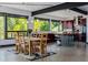 Bright open-concept kitchen features modern appliances, counter seating and beautiful views of the surrounding landscape at 5896 Peregrine Trl, Golden, CO 80403