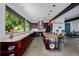 Spacious kitchen boasts sleek countertops, an eat-in island, ample cabinet space, and stunning views of the forest at 5896 Peregrine Trl, Golden, CO 80403