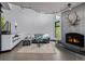 The living room offers a fireplace and comfortable seating at 5896 Peregrine Trl, Golden, CO 80403