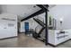 The staircase features modern railings and provides access to the home's upper levels at 5896 Peregrine Trl, Golden, CO 80403