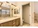 Bathroom featuring double sink vanity with tile backsplash at 19259 E Caspian Pl, Aurora, CO 80013