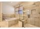 Luxurious bathroom with separate tub and glass-enclosed shower at 19259 E Caspian Pl, Aurora, CO 80013