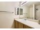 Bathroom featuring a large mirror, vanity with sink, and a tiled shower/tub combo at 19259 E Caspian Pl, Aurora, CO 80013