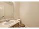 Powder room featuring vanity with countertop and wood-colored toilet seat at 19259 E Caspian Pl, Aurora, CO 80013