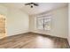 Bright Primary bedroom with wood floors and large window at 19259 E Caspian Pl, Aurora, CO 80013