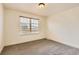 Bright bedroom with neutral walls, carpet, and a window with wooden blinds at 19259 E Caspian Pl, Aurora, CO 80013